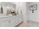Elegant bathroom features double sinks, white cabinets, and a large mirror at 109 Ailey Brook Way # 100, Wake Forest, NC 27587
