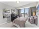 Comfortable bedroom with great lighting, plush bedding, and modern decor at 109 Ailey Brook Way # 100, Wake Forest, NC 27587