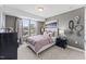 Cozy bedroom with gray walls, a large window, and a comfortable bed at 109 Ailey Brook Way # 100, Wake Forest, NC 27587