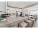 Modern kitchen featuring granite counters, stainless appliances, and seating at island at 109 Ailey Brook Way # 100, Wake Forest, NC 27587
