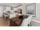 Eat-in kitchen features white cabinets, stainless steel appliances, and barstool seating at the island at 109 Ailey Brook Way # 100, Wake Forest, NC 27587