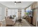Inviting living room with light-filled windows, neutral furnishings, and a modern touch at 109 Ailey Brook Way # 100, Wake Forest, NC 27587