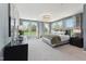 Spacious primary bedroom features large windows with a view of the outdoors at 109 Ailey Brook Way # 100, Wake Forest, NC 27587