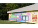 Colorful building with mural art that says 'Life is Sweet in Downtown Wake Forest' at 109 Ailey Brook Way # 100, Wake Forest, NC 27587