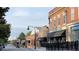 Charming street view showcasing brick buildings, shops, and lampposts in downtown at 109 Ailey Brook Way # 100, Wake Forest, NC 27587