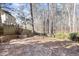 Stone patio and firepit area in a wooded backyard setting at 117 London Plain Ct, Cary, NC 27513