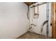 Unfinished basement laundry area with plumbing and electrical hookups at 117 London Plain Ct, Cary, NC 27513