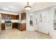 Eat-in kitchen with stainless steel appliances and wood cabinets at 117 London Plain Ct, Cary, NC 27513
