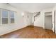 Living area with hardwood floors and access to stairs at 117 London Plain Ct, Cary, NC 27513