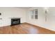 Living room with hardwood floors and a fireplace at 117 London Plain Ct, Cary, NC 27513