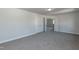 Spacious bonus room featuring neutral walls, carpet flooring and closet for flexible usage at 128 High Hampton Way, Fuquay Varina, NC 27526