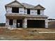 New construction home with wrap-around house wrap at 128 High Hampton Way, Fuquay Varina, NC 27526