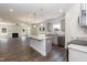 Modern kitchen with gray cabinets, granite countertops, and an island at 128 High Hampton Way, Fuquay Varina, NC 27526