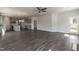 Open concept living room with hardwood floors extends into the modern kitchen at 128 High Hampton Way, Fuquay Varina, NC 27526