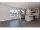 Spacious living room with fireplace, ceiling fan, and hardwood floors, perfect for entertaining and relaxing at 128 High Hampton Way, Fuquay Varina, NC 27526