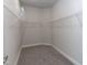 Walk-in closet featuring carpeted floor and wire shelving at 128 High Hampton Way, Fuquay Varina, NC 27526