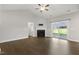 Spacious living room with hardwood floors, fireplace and sliding glass doors at 129 Colby Farm Dr, Kenly, NC 27542