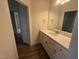 Bright bathroom featuring solid surface vanity top with modern hardware and light fixtures at 15 Long Needle Ct # 38, Youngsville, NC 27596