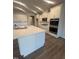 Modern kitchen featuring quartz countertops, stainless appliances, and a kitchen island at 15 Long Needle Ct # 38, Youngsville, NC 27596