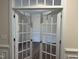 Bright office space featuring glass panel doors, classic trim, and hardwood floors at 15 Long Needle Ct # 38, Youngsville, NC 27596