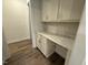 Built-in office nook featuring shaker style cabinets, solid surface countertop and modern hardware at 15 Long Needle Ct # 38, Youngsville, NC 27596