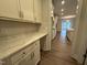 Kitchen nook with white shaker cabinets, solid surface countertop and stainless hardware at 15 Long Needle Ct # 38, Youngsville, NC 27596