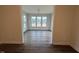 Bright sunroom features hardwood floors and large windows overlooking the landscape at 15 Long Needle Ct # 38, Youngsville, NC 27596