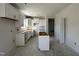 White kitchen cabinets, large island, and ample counter space at 15 Lupin Dr, Smithfield, NC 27577