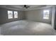 Large main bedroom with two windows and a ceiling fan at 15 Lupin Dr, Smithfield, NC 27577