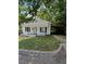 White house with carport and yard at 1512 Montrose St, Raleigh, NC 27603