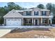 Two story house with attached garage, snow covered lawn at 157 Winston Pointe Dr, Clayton, NC 27520