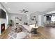 Virtually staged living room features hardwood floors and an open floor plan at 157 Winston Pointe Dr, Clayton, NC 27520