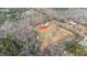 Scenic aerial view of property nestled among trees, showcasing its expansive landscape at 1696 James Winston Rd, Oxford, NC 27565