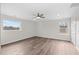 Bedroom with two windows, wood floors and ceiling fan at 1696 James Winston Rd, Oxford, NC 27565