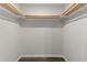 A walk-in closet with wooden trim, offering plenty of storage space at 1696 James Winston Rd, Oxford, NC 27565