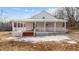 Lovely white house with covered porch, number on house adds curb appeal at 1696 James Winston Rd, Oxford, NC 27565