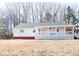 Inviting white home featuring a covered porch and a well-maintained yard at 1696 James Winston Rd, Oxford, NC 27565