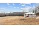 Charming home with a spacious porch and scenic views of the surrounding property at 1696 James Winston Rd, Oxford, NC 27565