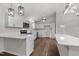 Bright kitchen features white cabinets, stainless steel appliances and wood floors at 1696 James Winston Rd, Oxford, NC 27565