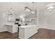 Modern kitchen featuring white cabinetry, stainless steel appliances, and center island at 1696 James Winston Rd, Oxford, NC 27565