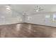Spacious living room with multiple ceiling fans and wood floors at 1696 James Winston Rd, Oxford, NC 27565