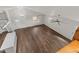 Open-concept living room with high ceilings, ceiling fans, and hardwood floors at 1696 James Winston Rd, Oxford, NC 27565