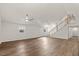 Bright and airy living room with wood floors, fan, and staircase at 1696 James Winston Rd, Oxford, NC 27565
