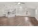 Open floor plan living room with multiple ceiling fans and wood floors at 1696 James Winston Rd, Oxford, NC 27565