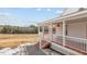 View of home's porch with red floors and white railings, inviting outdoor living space at 1696 James Winston Rd, Oxford, NC 27565