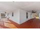 Spacious wrap around porch with wood flooring, ample seating, and ceiling fans at 1696 James Winston Rd, Oxford, NC 27565