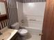 Clean bathroom with a bathtub and shower combination at 201 Providence Rd, Oxford, NC 27565