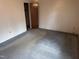 Simple bedroom with carpeted floor and door at 201 Providence Rd, Oxford, NC 27565