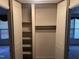 Spacious bedroom closet with shelves and hanging rod at 201 Providence Rd, Oxford, NC 27565