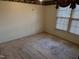 Bright bedroom with carpeted floors and window at 201 Providence Rd, Oxford, NC 27565